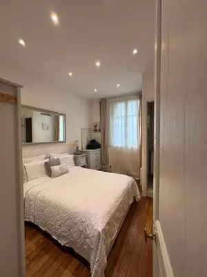 Un ou plusieurs lits dans un hébergement de l'établissement Appart à deux pas de paris expo