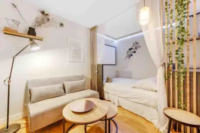 Un ou plusieurs lits dans un hébergement de l'établissement Appartement Panorama - à seulement 15 minutes des Champs-Élysées