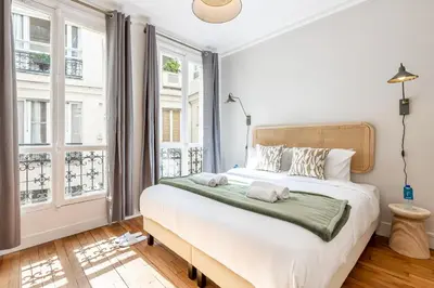 Un ou plusieurs lits dans un hébergement de l'établissement Sweett - Maison Wagram
