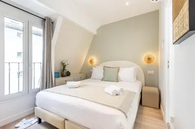 Un ou plusieurs lits dans un hébergement de l'établissement Sweett - Maison Wagram