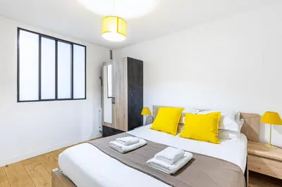 Un ou plusieurs lits dans un hébergement de l'établissement GuestReady - Fantastic stay near Musée du Louvre