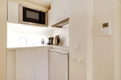Cuisine ou kitchenette dans l'établissement Pick A Flat's Apartment on l'Ile de la Cité - Quai de L'Horloge