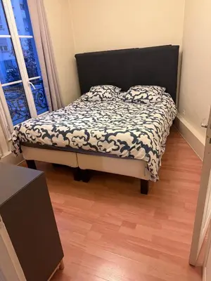 Un ou plusieurs lits dans un hébergement de l'établissement Amazing 1 bedroom, 30sec from Arc de Triomphe