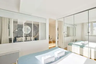 Un ou plusieurs lits dans un hébergement de l'établissement Bel appartement au coeur de Montorgueil