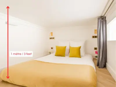 Un ou plusieurs lits dans un hébergement de l'établissement Merveil - Luxury Suite - Louvre - Therese