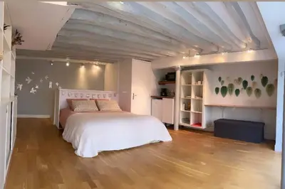 Un ou plusieurs lits dans un hébergement de l'établissement Beau studio Gare de Lyon