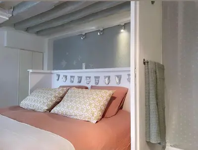 Un ou plusieurs lits dans un hébergement de l'établissement Beau studio Gare de Lyon