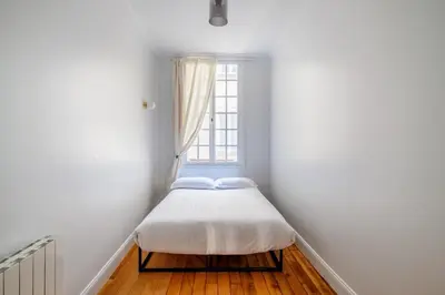 Un ou plusieurs lits dans un hébergement de l'établissement Luxury Living à Montorgueil