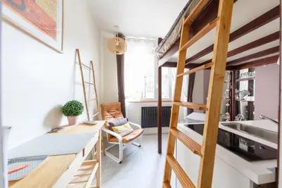 Un ou plusieurs lits dans un hébergement de l'établissement Sacré Petit Studio in the Coeur of Montmartre