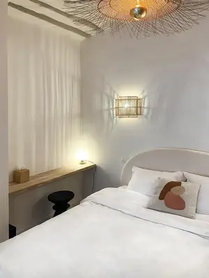 Un ou plusieurs lits dans un hébergement de l'établissement Canettes Deluxe Apartment
