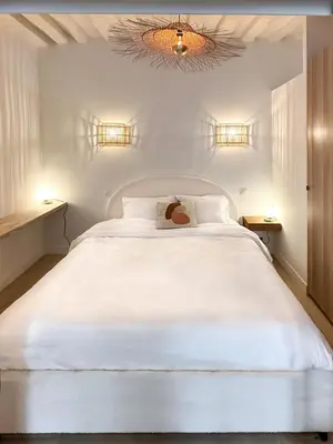 Un ou plusieurs lits dans un hébergement de l'établissement Canettes Deluxe Apartment