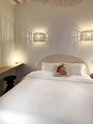 Un ou plusieurs lits dans un hébergement de l'établissement Canettes Deluxe Apartment