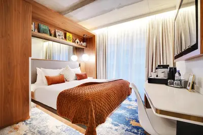 Un ou plusieurs lits dans un hébergement de l'établissement CARD Hôtel