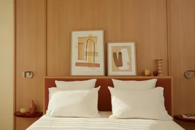 Un ou plusieurs lits dans un hébergement de l'établissement OKKO Hotels Paris Rosa Parks