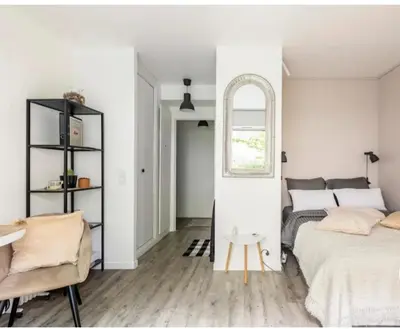 Un ou plusieurs lits dans un hébergement de l'établissement Studio Cosy Paris centre alesia