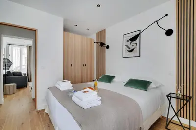 Un ou plusieurs lits dans un hébergement de l'établissement Welcoming apartment - 1BR-4P - Sacré-Cœur