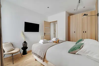 Un ou plusieurs lits dans un hébergement de l'établissement Welcoming apartment - 1BR-4P - Sacré-Cœur