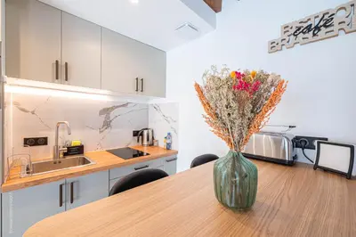 Cuisine ou kitchenette dans l'établissement Le Petit Rex