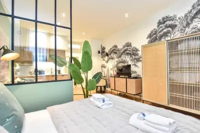 Un ou plusieurs lits dans un hébergement de l'établissement Cosy apartment - 1BR-3P - Rue du Bac