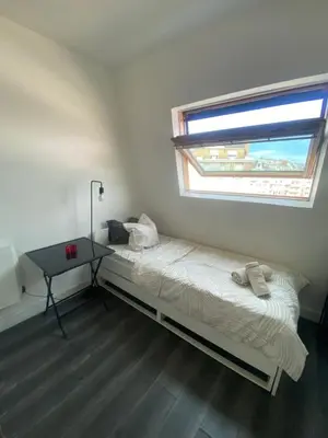 Un ou plusieurs lits dans un hébergement de l'établissement Studio la griotte