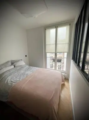 Un ou plusieurs lits dans un hébergement de l'établissement Luxe Cosy appart au Parc Monceau