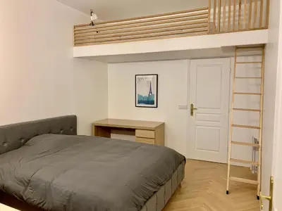 Un ou plusieurs lits dans un hébergement de l'établissement Charming loft style appartment in center of marais
