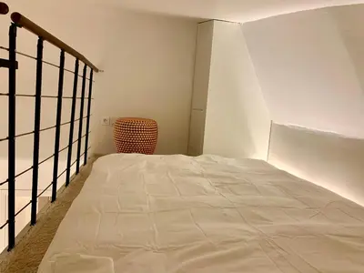 Un ou plusieurs lits dans un hébergement de l'établissement Charming loft style appartment in center of marais
