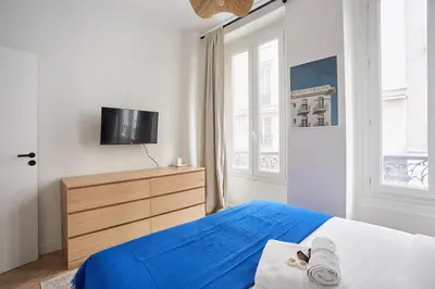 Un ou plusieurs lits dans un hébergement de l'établissement Duplex Center of Paris by Studio prestige
